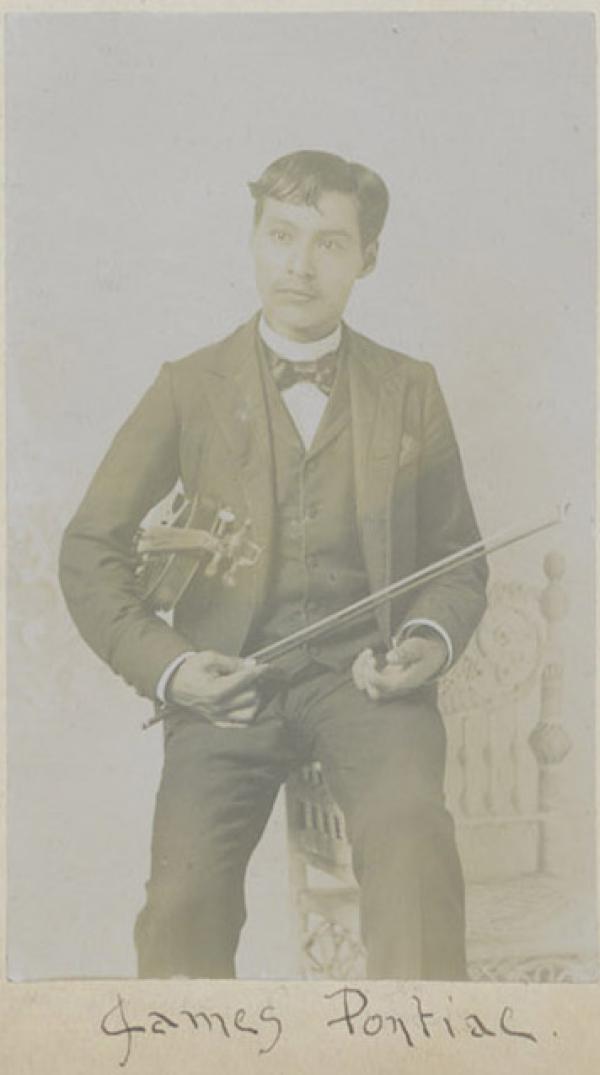 James Pontiac posed with violin, c.1894