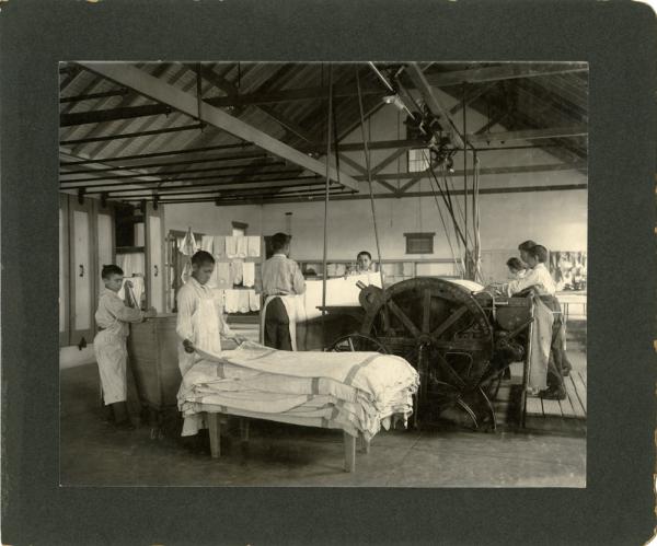 Male Students Operating Mangle in Laundry, 1901