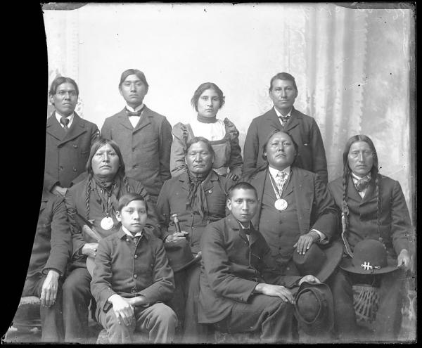 Five visiting chiefs with five male and one female student, c.1885