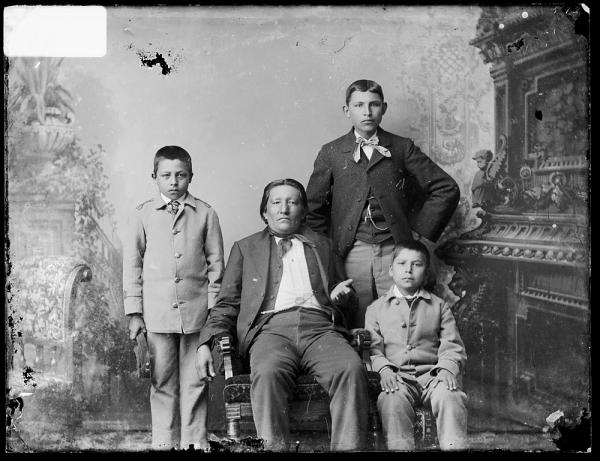 Visiting chief with three male students, c.1885