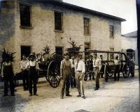 Male Students with Fire Wagon Outside Building, c.1909