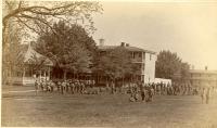 School band and other students on the school grounds, c.1885