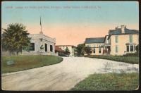 color image; view of the road leading up to the art studio (on the left) and staff housing (on the right), just inside the entrance gate on this side of campus. The image has been colorized with a peach and blue sky