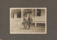 Two unidentified male students in front of Carlisle banner, c.1904
