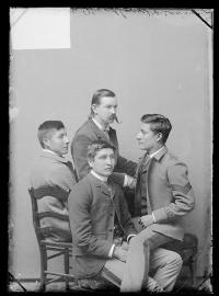 Three male students with J.M. Woodburne, c.1889