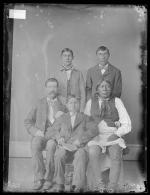 Visiting chief, three male students, and one white man, c.1885
