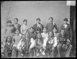Five visiting Cheyenne chiefs and ten female students, c.1885