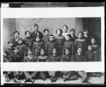 Twenty-one unidentified students with one white woman, c.1897