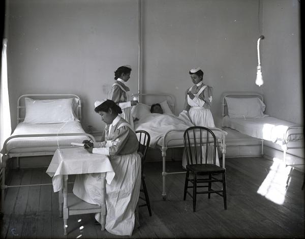 Three Student Nurses and a Male Patient, c. 1909