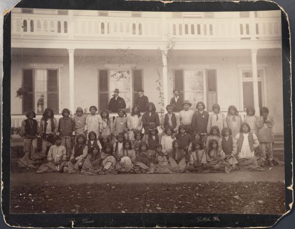 Apache Prisoners of War Upon Arrival Posed in Front of a Building, 1886