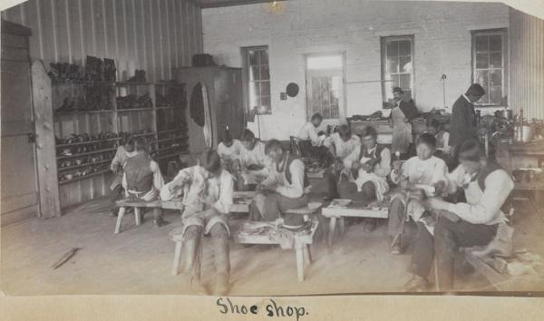 Students and instructor in the shoe shop, c.1885