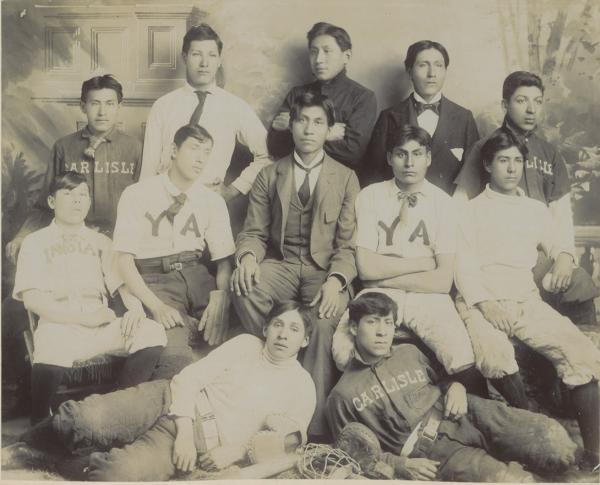 Twelve male students with baseball equipment, c.1895