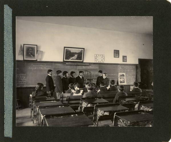 Students in Classroom Posed With Chair, 1901