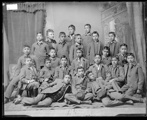 Teacher Miss Hunt with twenty-one male students, c.1891
