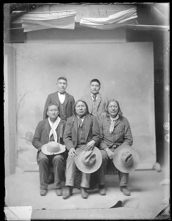 Charles Smith with three visiting chiefs and one male student, c.1891