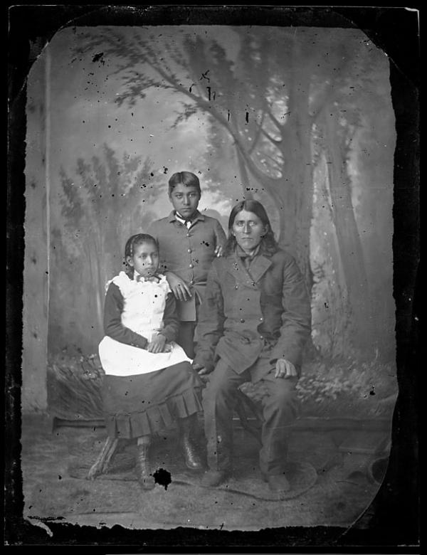 Native American man with a male and a female student, c.1881