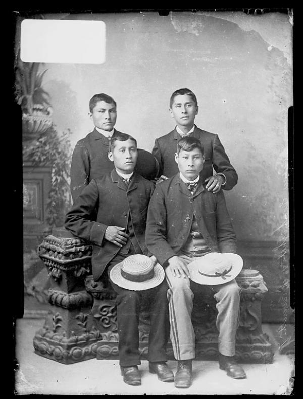 Eustace Esapoyhet, Frank Everett, and two unidentified young men, c.1890