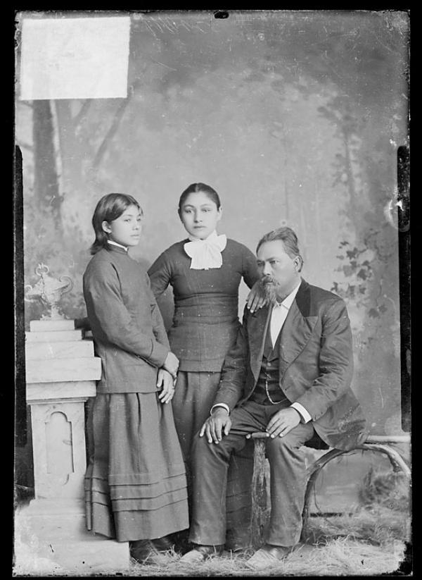 Martha Moore and Ella Moore with their father, John R. Moore [version 1], c.1882