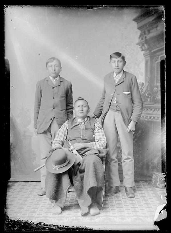 Black Dog and two male students, c.1895