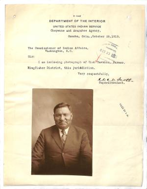 Personnel Folder of Kish Hawkins letter with sepia-toned photograph attached, portrait of a man in suit and tie, slightly smiling