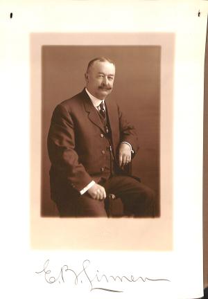 Selections from Personnel Folder of Edward B. Linnen photograph of man in suit and tie, sitting sideways on chair