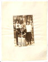 photograph of three women, two standing, one sitting, labelled "Gaither, Jennie, matron"