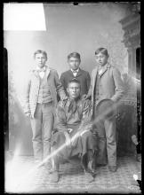 Osage chief with three male students, c.1891