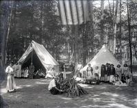 Female students around a campfire at Camp Sells, c. 1913