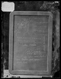 Slate showing student work with name Luther Otakte [version 1], c. 1880