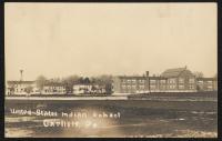 real photo postcard, view of the buildings on the north-west end of campus (includes academic building closest to the viewer, then teachers' quarters, staff housing, and dining hall)