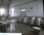 Female Students Working at Sinks in Laundry Room, c. 1910