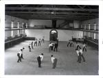 Male Students Preparing to Begin Game of Basketball