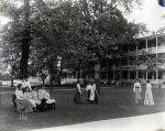 Teacher and Female Students with Girls' Quarters, c. 1909