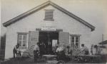 Students making wheels in front of the Blacksmith and Wagon Shop, c.1890