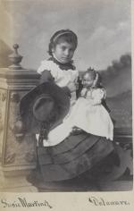 Susie Martinez holding a doll [version 3], c.1883