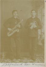 David McFarland and Ben Harrison holding musical instruments, c.1893