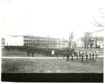 Male students in formation with band on school grounds, c. 1910 Male students in formation with band on school grounds, c. 1910