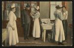 color image; five people stand in the dispensary of the school hospital, one woman (dressed in all white) stands to the left side watching as two young women give vaccinations to two young men, the young women have long white aprons over blue patterned dresses