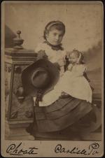 Susie Martinez holding a doll [version 2], c.1883