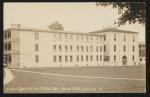 Sepia-toned image, veiw of one of the wings of the girls' quarters and the school gymnasium, photo taken from perspective of assistant superintendent's quarters