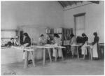 Female Students Ironing in Laundry Room, 1901