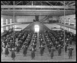 Female students in gymnasium lifting barbells, c.1887