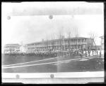 Photograph of a photograph of students on parade on school grounds, c.1885