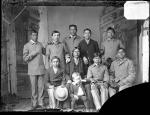 Standing Bear with eight male students and one young white boy, c.1881