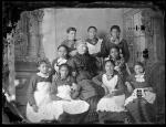 Nine unidentified female students with female teacher, c.1887