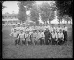 Student baseball team posed on school grounds, c.1885