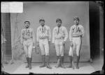 Four young men in baseball uniforms, c.1889