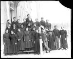 Male and female students with two female teachers, c.1890