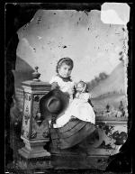 Susie Martinez holding a doll [version 1], c.1883
