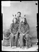 Charles Smith with two unidentified young men in native dress, 1887